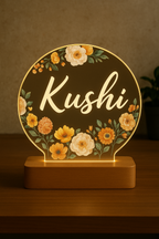 Personalized flower name lamp glowing on table

