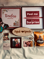 Curated hamper featuring Polaroids, Wallet Card, butterfly surprise, and Love Timber – romantic couple gift