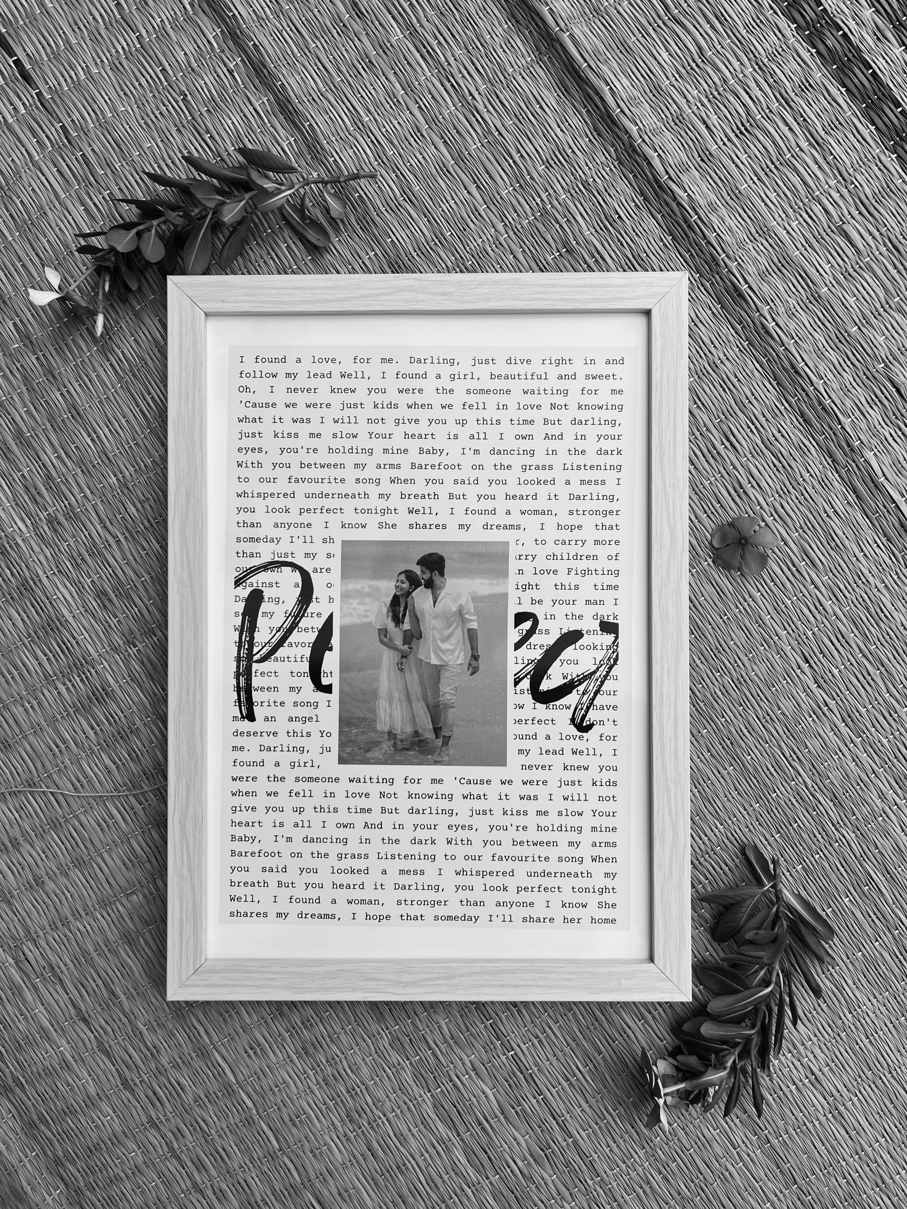 Close-up of lyrics and photo centerpiece – wedding or birthday keepsake